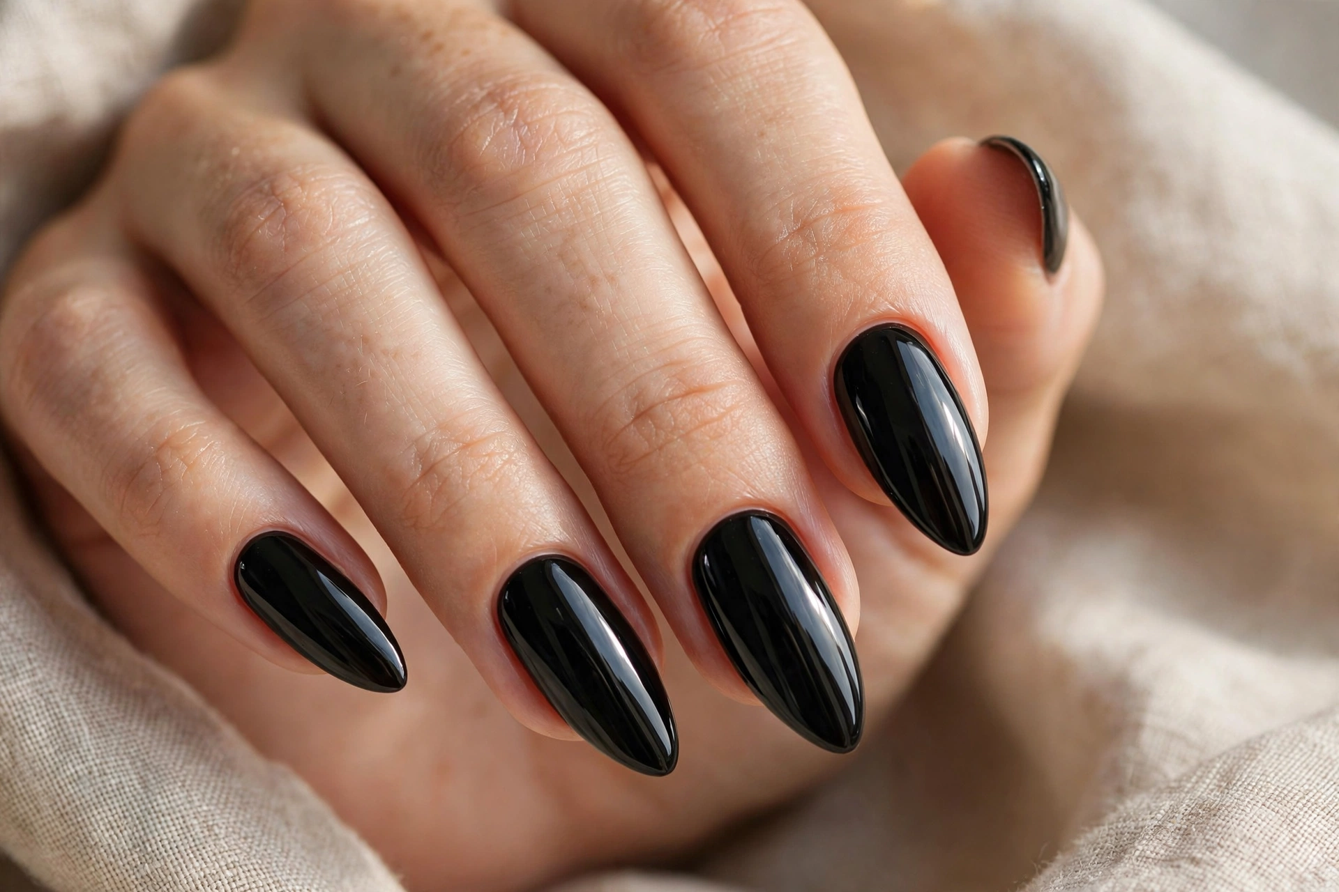 Black almond nail designs for a bold elegant manicure