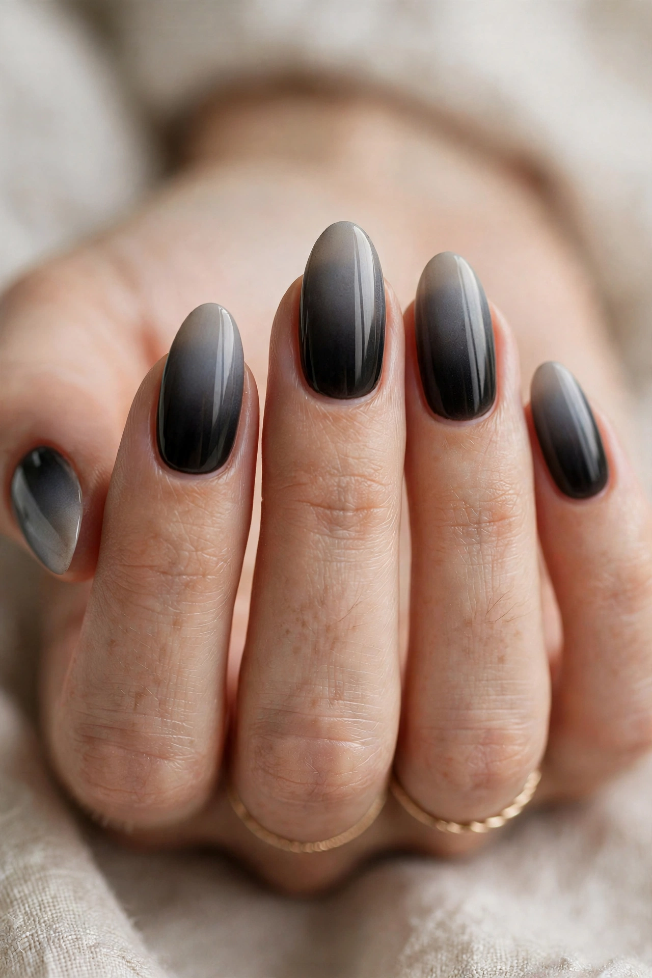 Black ombre nail designs fading from nude to black at the tips